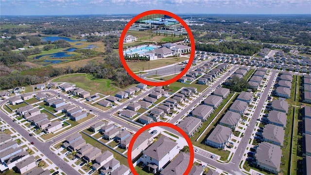 birds eye view of property with a residential view