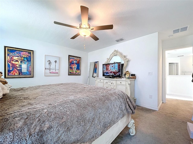 bedroom with a textured ceiling, carpet, visible vents, and baseboards