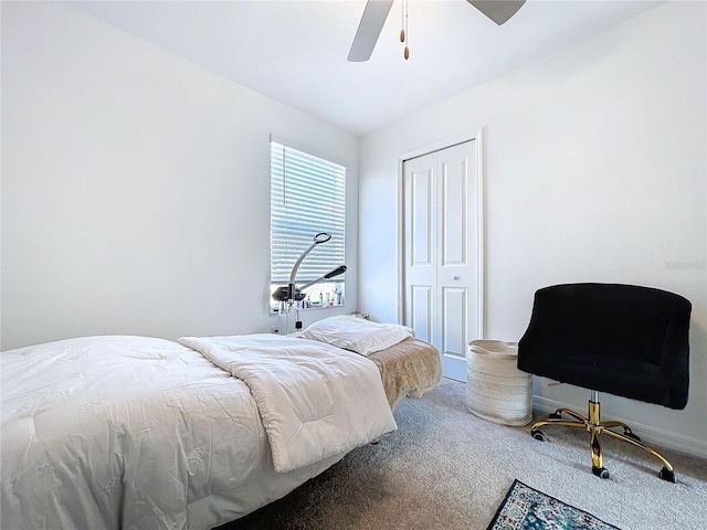 bedroom with ceiling fan, carpet floors, and a closet