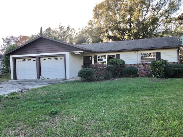 ranch-style house featuring a garage and a front lawn