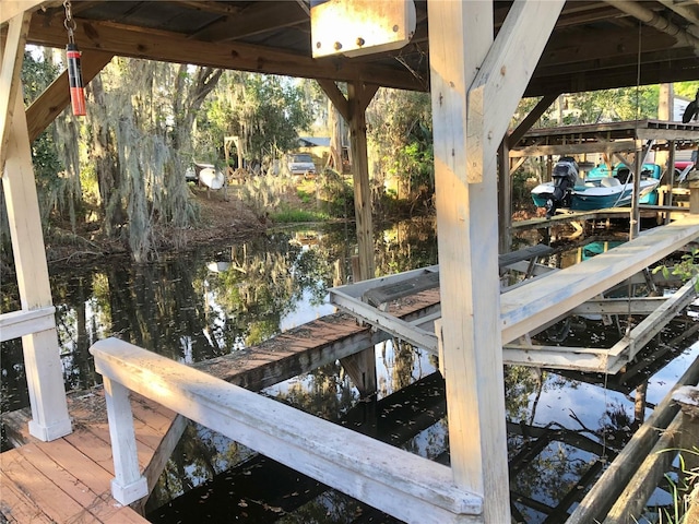 dock area with a water view