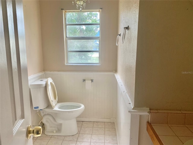 bathroom featuring tile patterned flooring and toilet