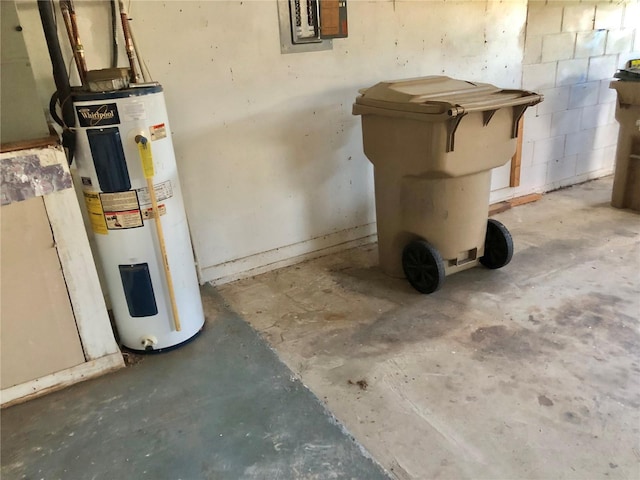 utility room featuring electric panel and water heater