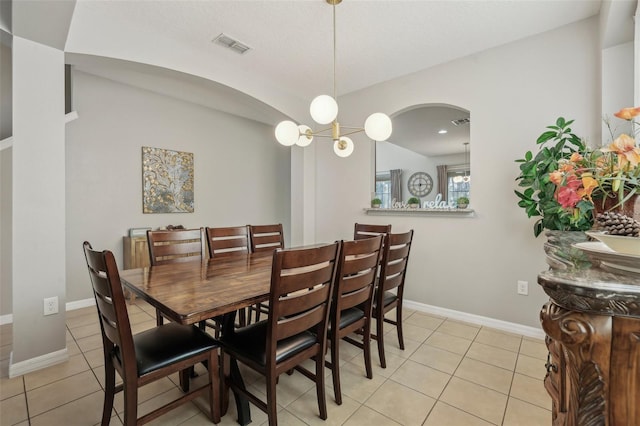 dining area with light tile patterned floors