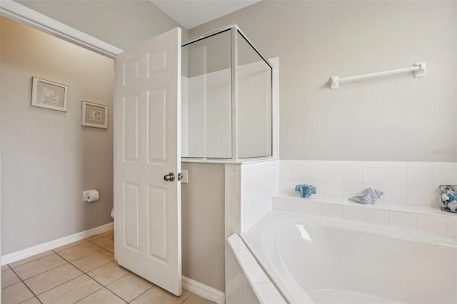 bathroom with tile patterned floors and independent shower and bath