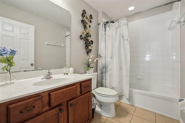 full bathroom with shower / tub combo with curtain, tile patterned flooring, vanity, and toilet