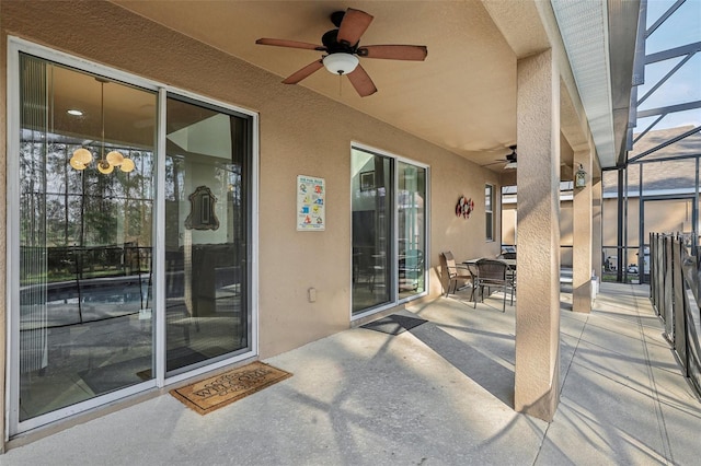 view of patio / terrace featuring a lanai and ceiling fan