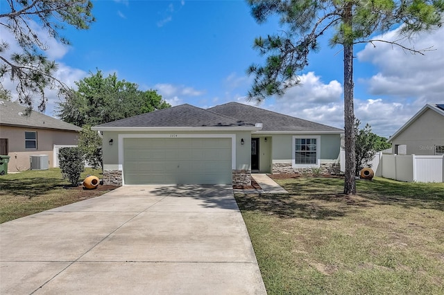 view of front facade featuring a garage, central AC unit, and a front lawn