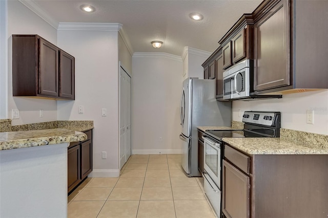 kitchen with ornamental molding, stainless steel appliances, dark brown cabinetry, and light tile patterned floors