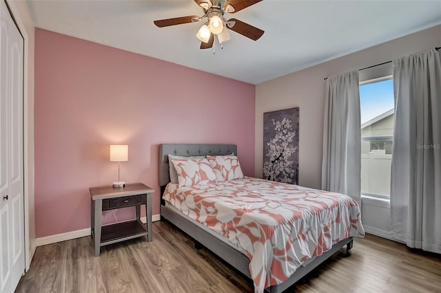 bedroom featuring wood-type flooring and ceiling fan