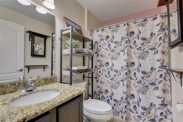 bathroom with vanity, a shower with shower curtain, a textured ceiling, and toilet