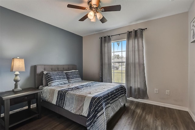 bedroom with ceiling fan and dark hardwood / wood-style flooring