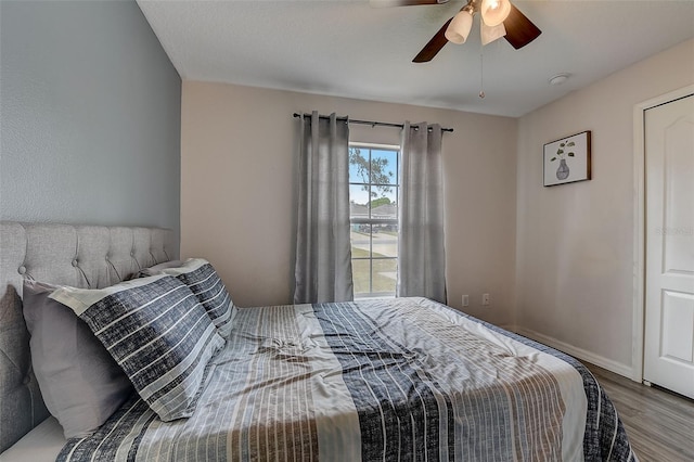 bedroom featuring ceiling fan and light hardwood / wood-style flooring