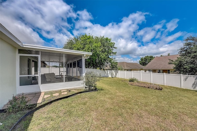 view of yard featuring a sunroom