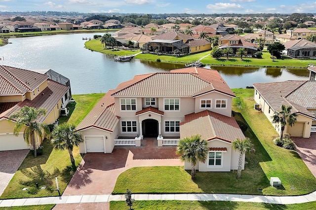 birds eye view of property featuring a water view and a residential view