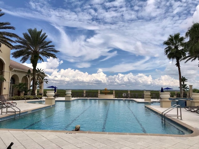 community pool with a patio