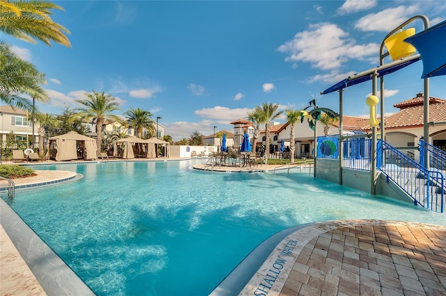 9918 Pallida Hickory Way, Winter Garden, FL 34787 - community pool with a water slide, a water play area, fence, and a patio