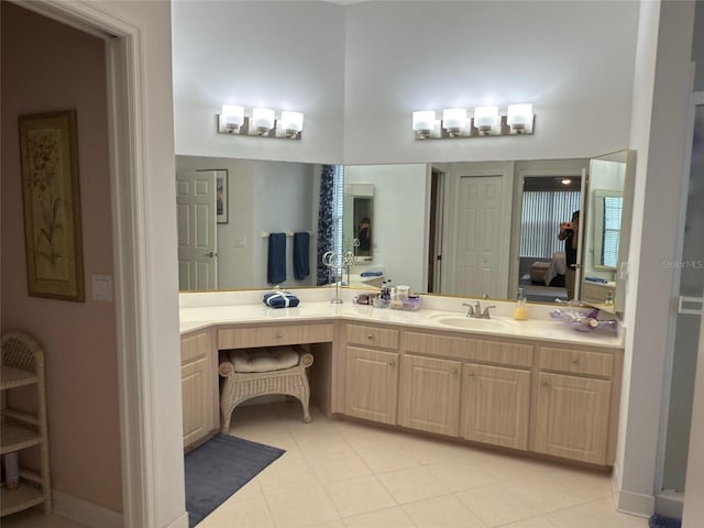 bathroom with a high ceiling and vanity