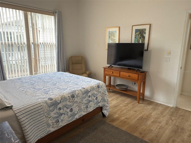 bedroom with light hardwood / wood-style floors