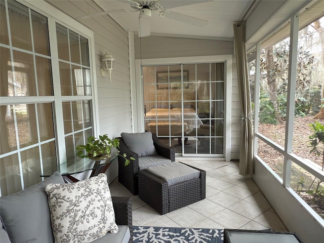 sunroom featuring ceiling fan and a healthy amount of sunlight