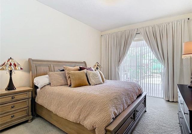 carpeted bedroom featuring access to exterior