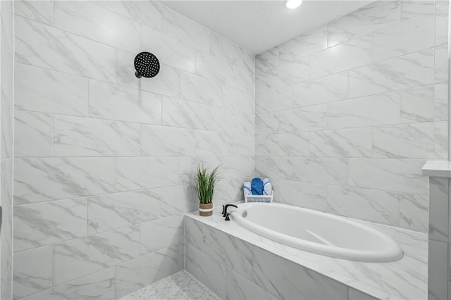 bathroom with a bath and tile walls