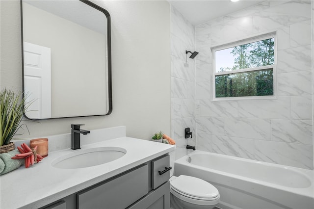 full bathroom featuring tub / shower combination, vanity, and toilet