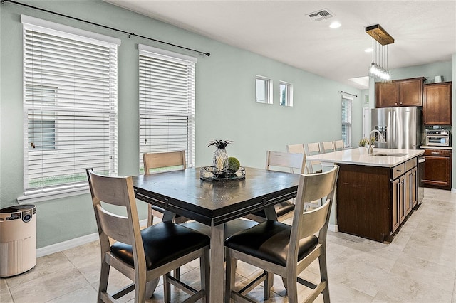 dining room with a wealth of natural light, visible vents, baseboards, and recessed lighting