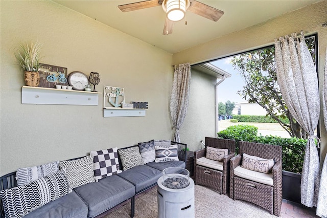 living area featuring a ceiling fan