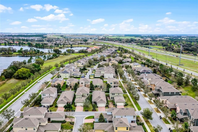 aerial view with a residential view and a water view