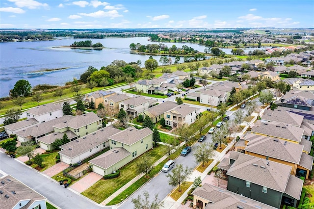 birds eye view of property featuring a water view and a residential view