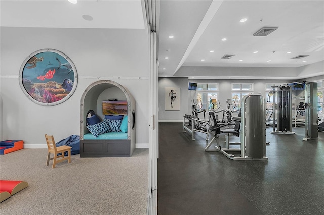 gym featuring baseboards, visible vents, and recessed lighting