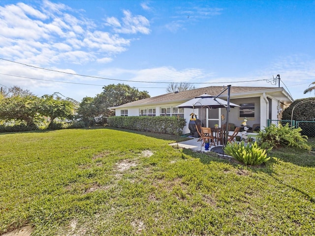 back of house with a patio, a yard, and a gazebo