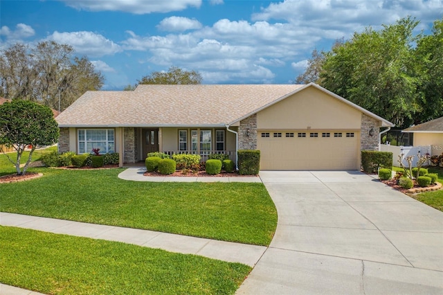 single story home with a garage, a porch, and a front yard