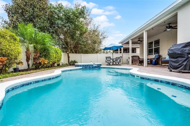 view of swimming pool with a ceiling fan, a fenced in pool, a fenced backyard, and a grill