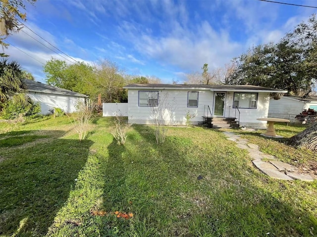 ranch-style house featuring a front lawn