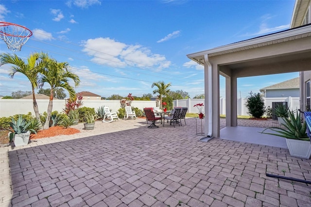 view of patio featuring a fenced backyard and outdoor dining area