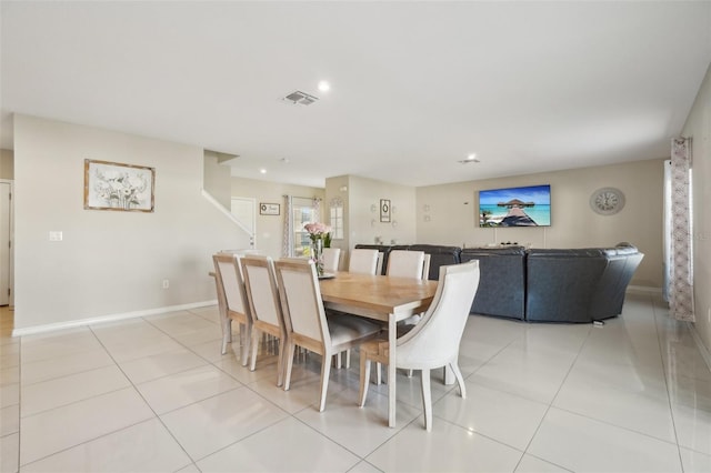 dining area with light tile patterned floors, baseboards, visible vents, and recessed lighting