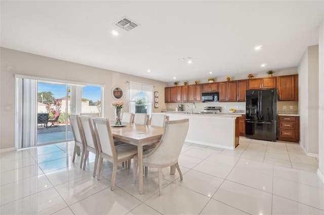 dining space with recessed lighting, visible vents, baseboards, and light tile patterned floors