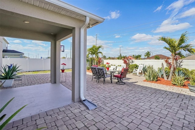 view of patio / terrace with outdoor dining space and a fenced backyard