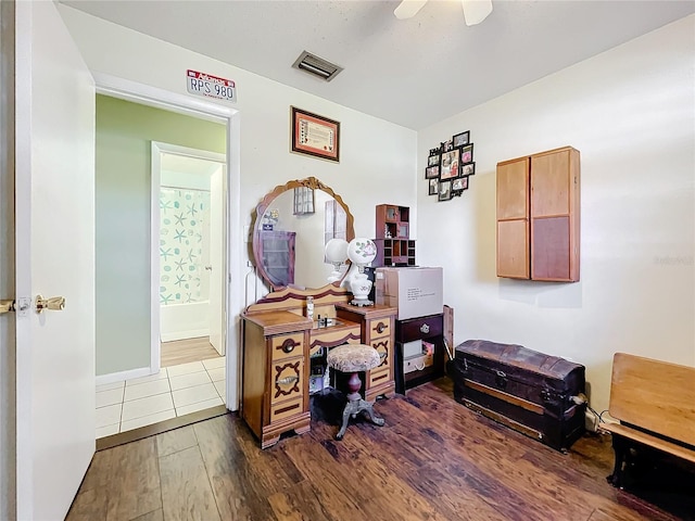 office space with ceiling fan and dark hardwood / wood-style floors