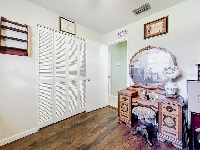 home office with dark hardwood / wood-style floors