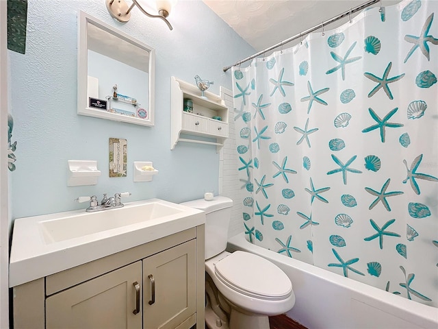 full bathroom featuring shower / bath combination with curtain, vanity, and toilet