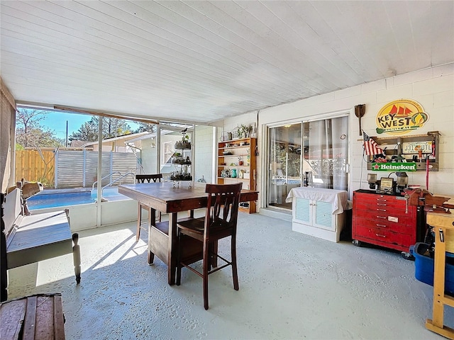 dining space featuring concrete flooring