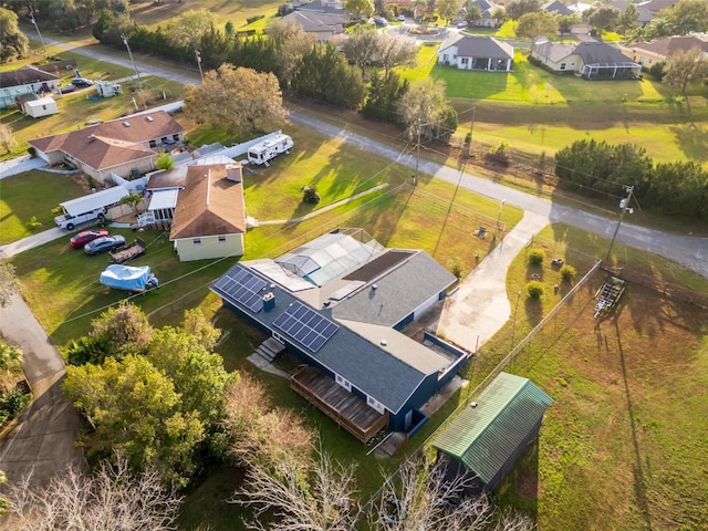 birds eye view of property with a residential view