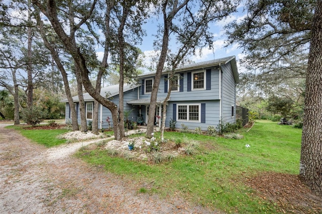 view of front of property with a front yard and driveway