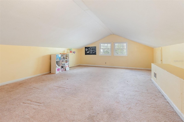 bonus room with carpet, baseboards, and vaulted ceiling