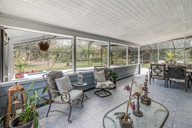 sunroom featuring vaulted ceiling and wooden ceiling