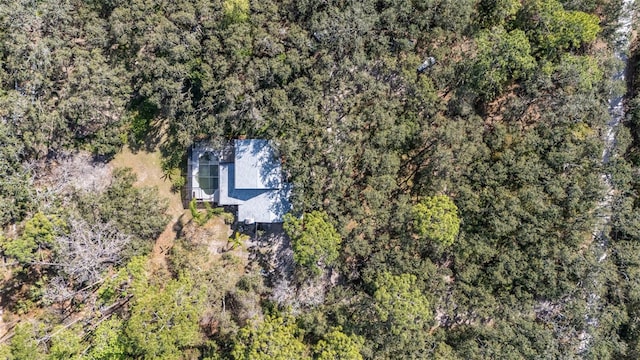 drone / aerial view with a view of trees