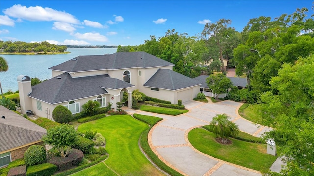 birds eye view of property featuring a water view